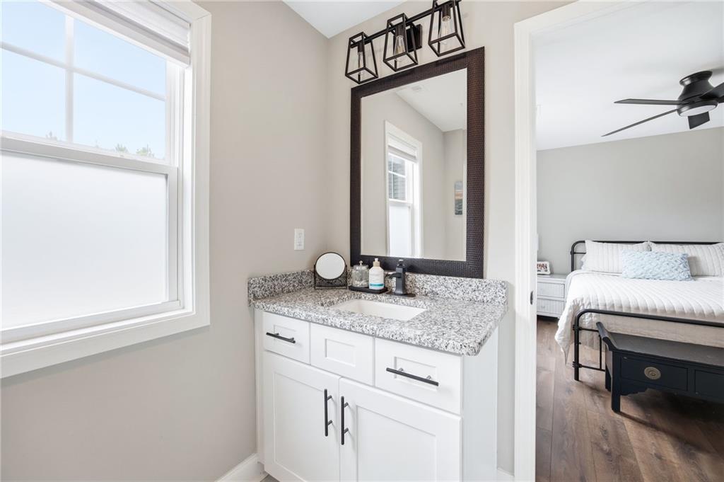 238 Observation Pointe Dallas, GA 30132 - Photo 27 of 41 a en suite bathroom with a granite countertop sink and a mirror