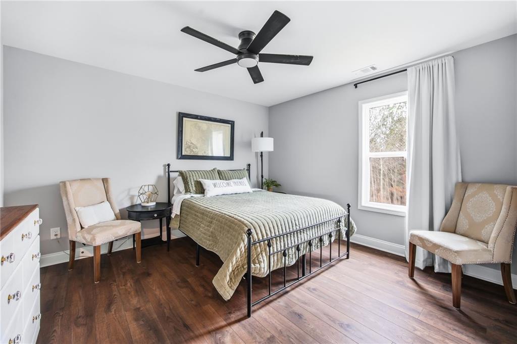 238 Observation Pointe Dallas, GA 30132 - Photo 28 of 41 a bedroom with a bed a couch and a window