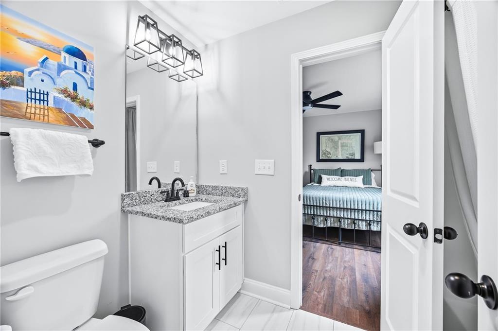 238 Observation Pointe Dallas, GA 30132 - Photo 29 of 41 a bathroom with a sink a toilet and a mirror