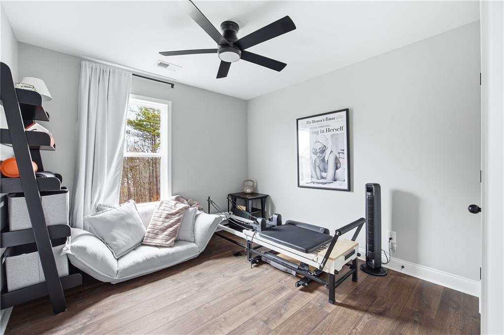 238 Observation Pointe Dallas, GA 30132 - Photo 30 of 41 a living room with furniture gym equipment and a large window