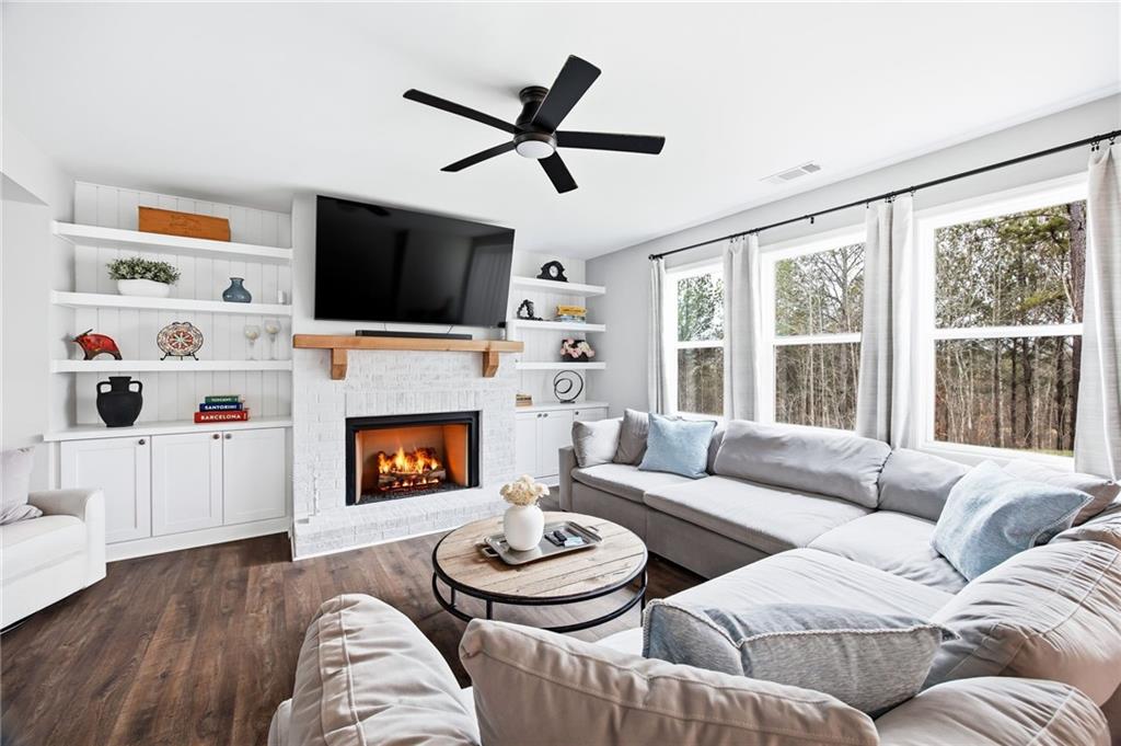 238 Observation Pointe Dallas, GA 30132 - Photo 3 of 41 a living room with furniture a fireplace and a flat screen tv