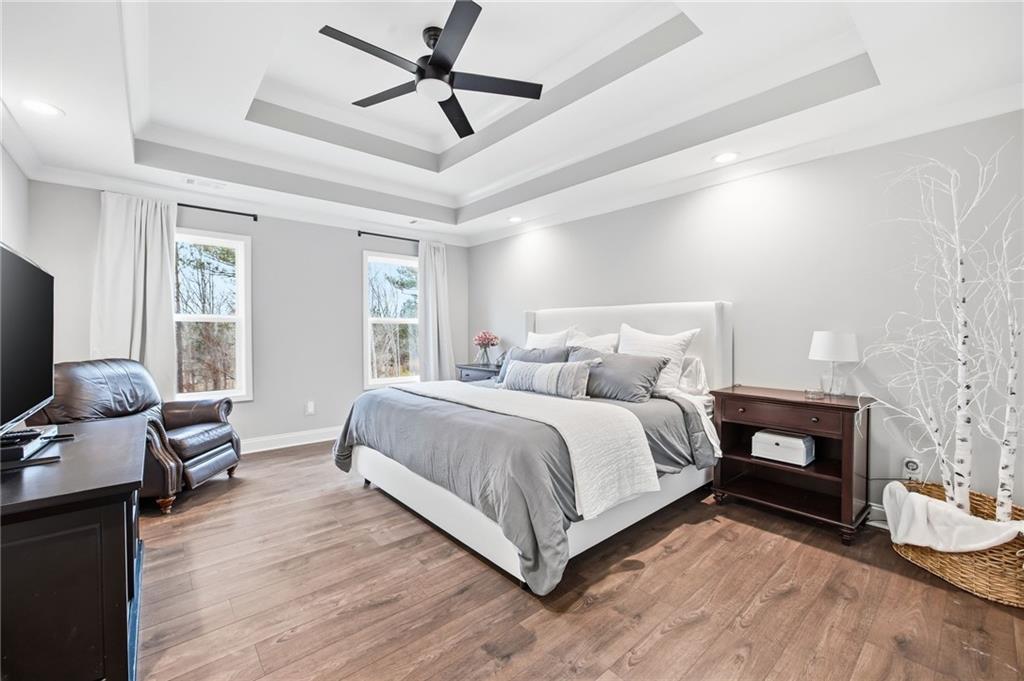 238 Observation Pointe Dallas, GA 30132 - Photo 4 of 41 a spacious bedroom with a bed and wooden floor