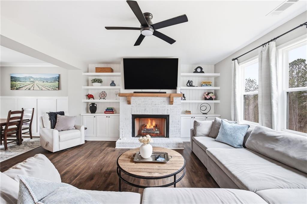 238 Observation Pointe Dallas, GA 30132 - Photo 9 of 41 a living room with furniture a fireplace and a flat screen tv