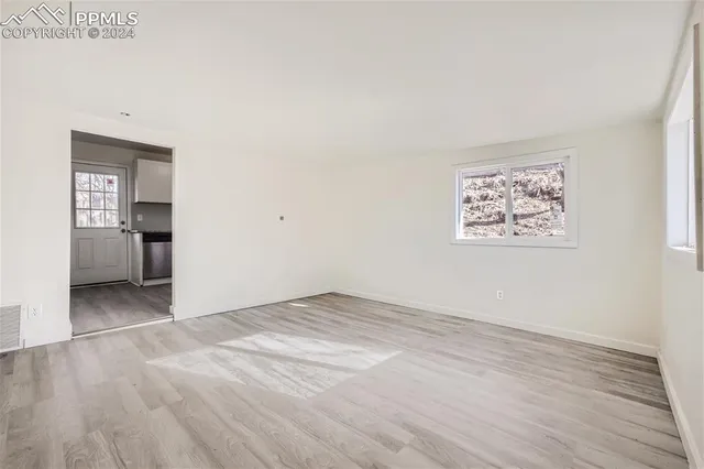 an empty room with a bench