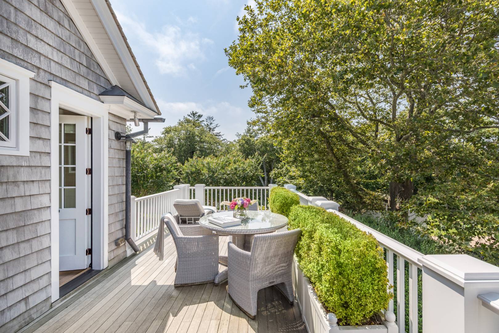 95 Egypt Lane East Hampton, NY 11937 - Photo 18 of 37 a balcony with furniture and wooden floor