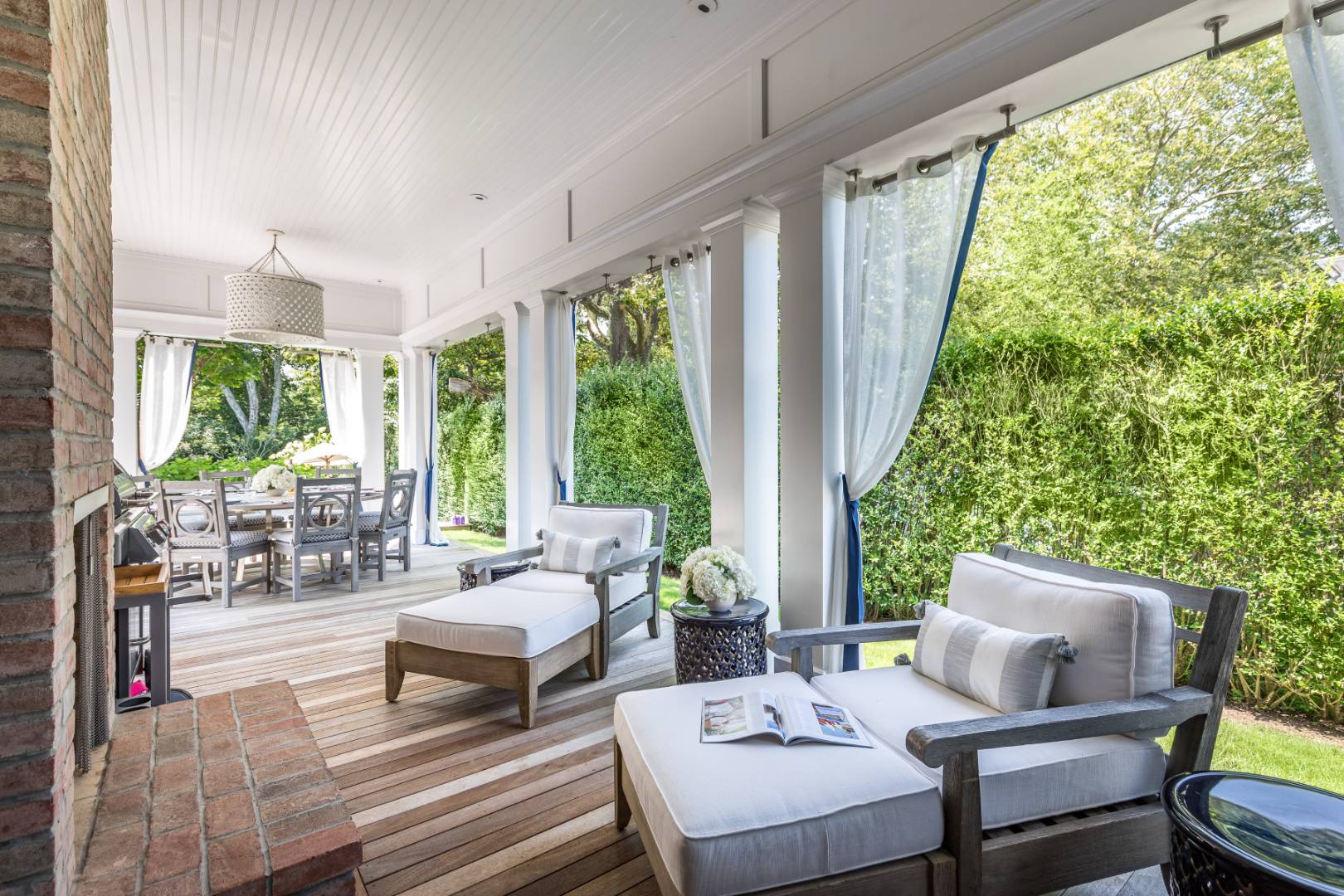 95 Egypt Lane East Hampton, NY 11937 - Photo 32 of 37 a living room with furniture and a large window
