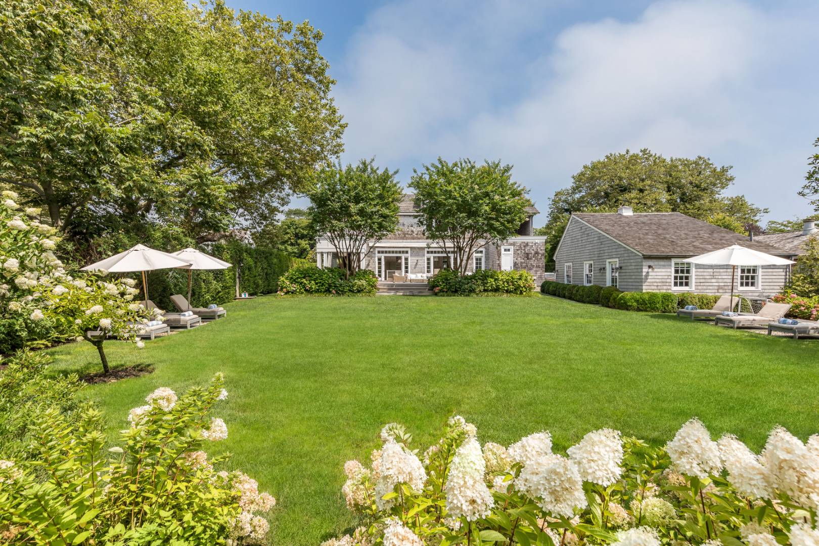 95 Egypt Lane East Hampton, NY 11937 - Photo 37 of 37 a front view of a house with garden
