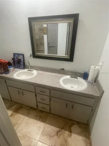a bathroom with a sink and a mirror