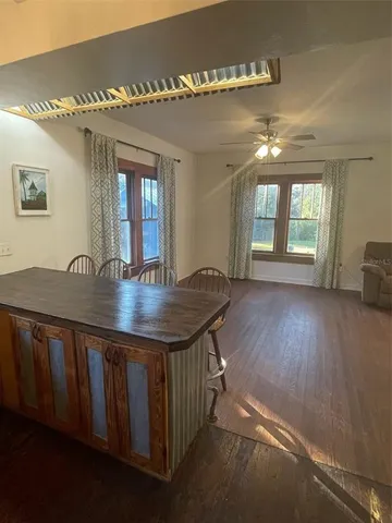 a workspace with furniture window and wooden floor