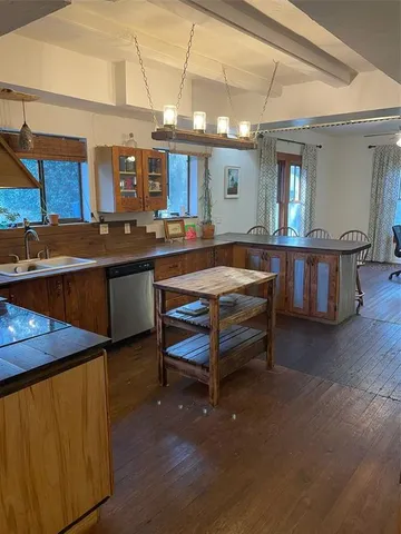 a kitchen with a sink and cabinets