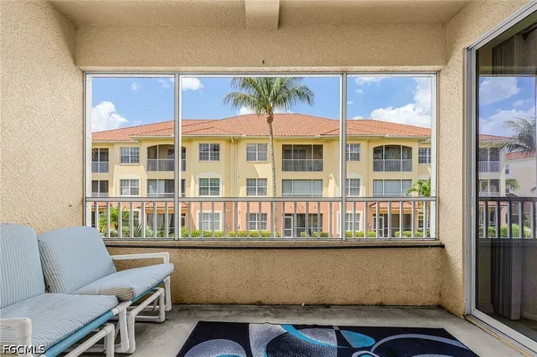 a view of a balcony with a large window