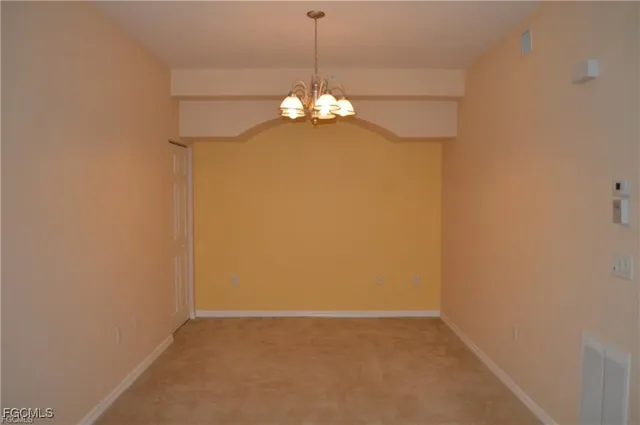 a view of a chandelier fan in a room