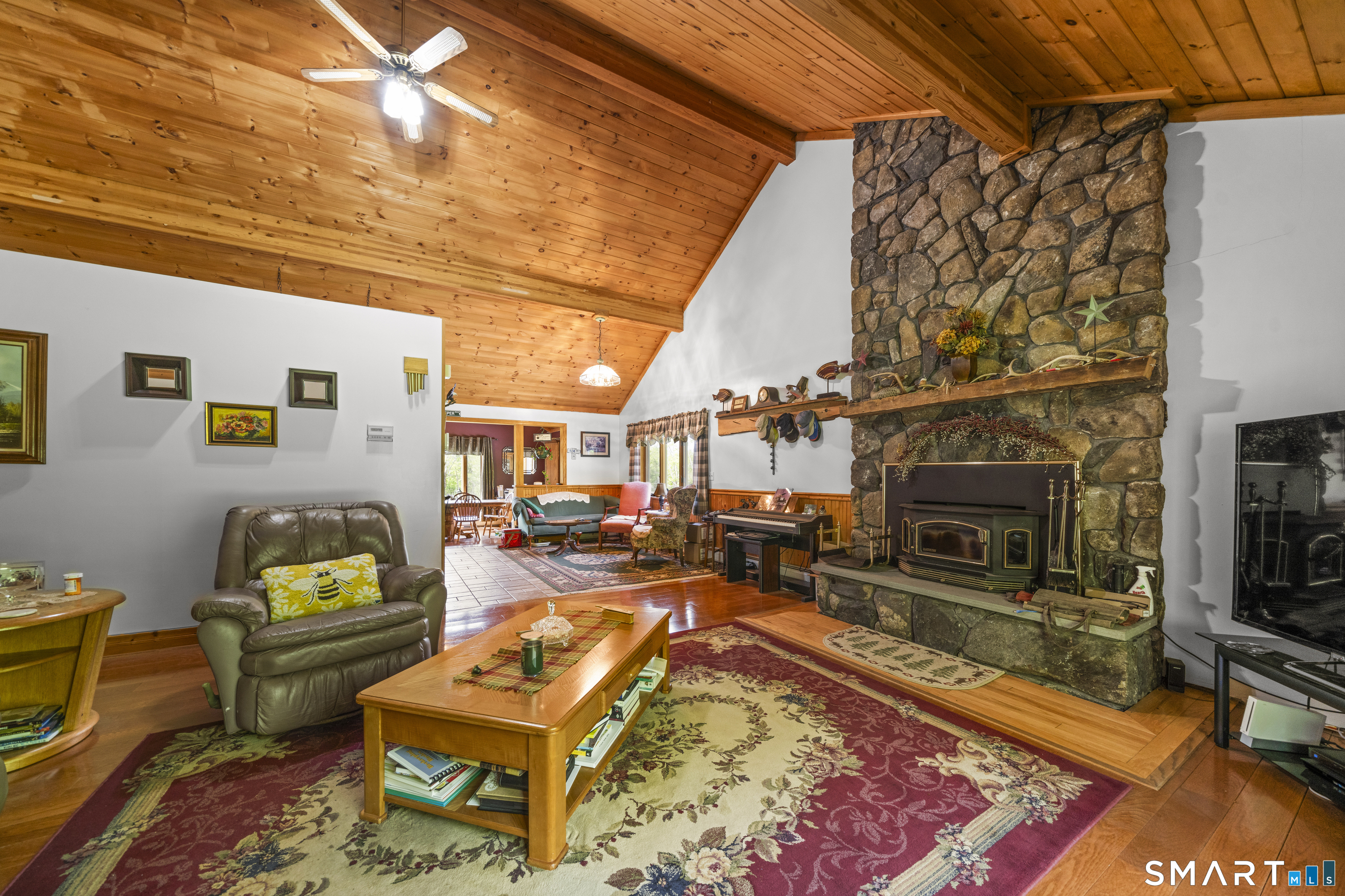 80 Holmes Road Goshen, CT 06756 - Photo 24 of 40 a living room with furniture and a fireplace
