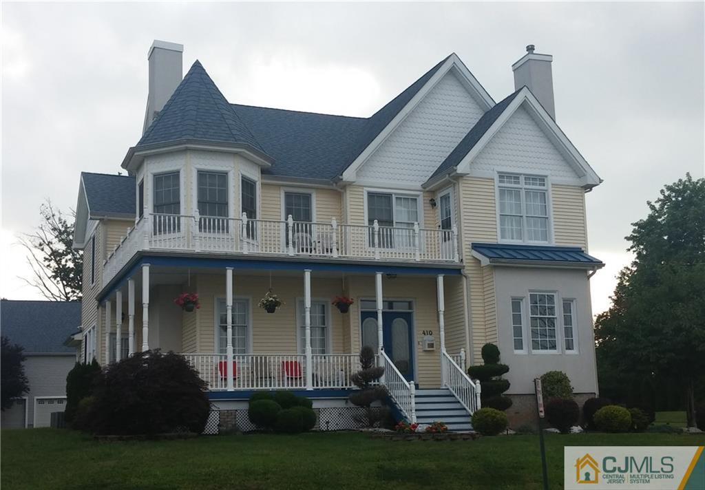 410 Cliff Road Sewaren, NJ 07077 - Photo 1 of 4 a front view of a house with a yard