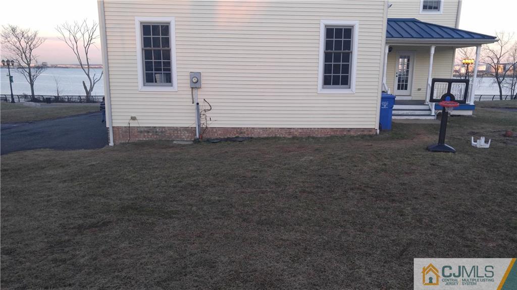 410 Cliff Road Sewaren, NJ 07077 - Photo 3 of 4 a view of a house with a yard