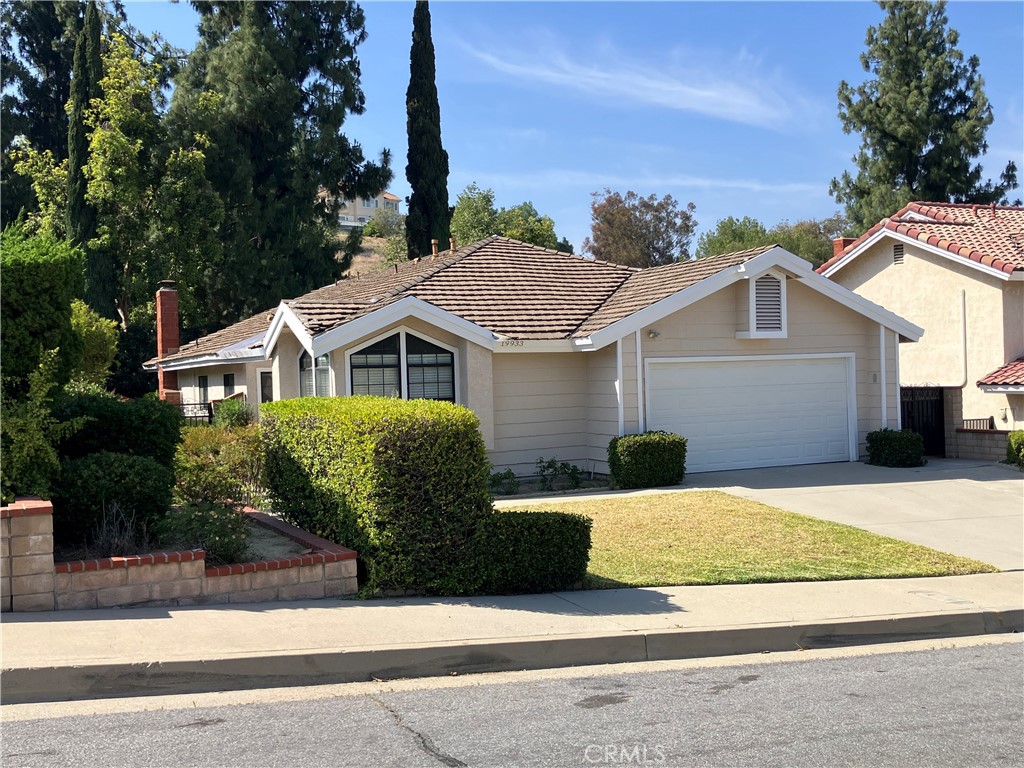 19933 Ralph Street Walnut, CA 91789 - Photo 5 of 77 a front view of a house with a yard
