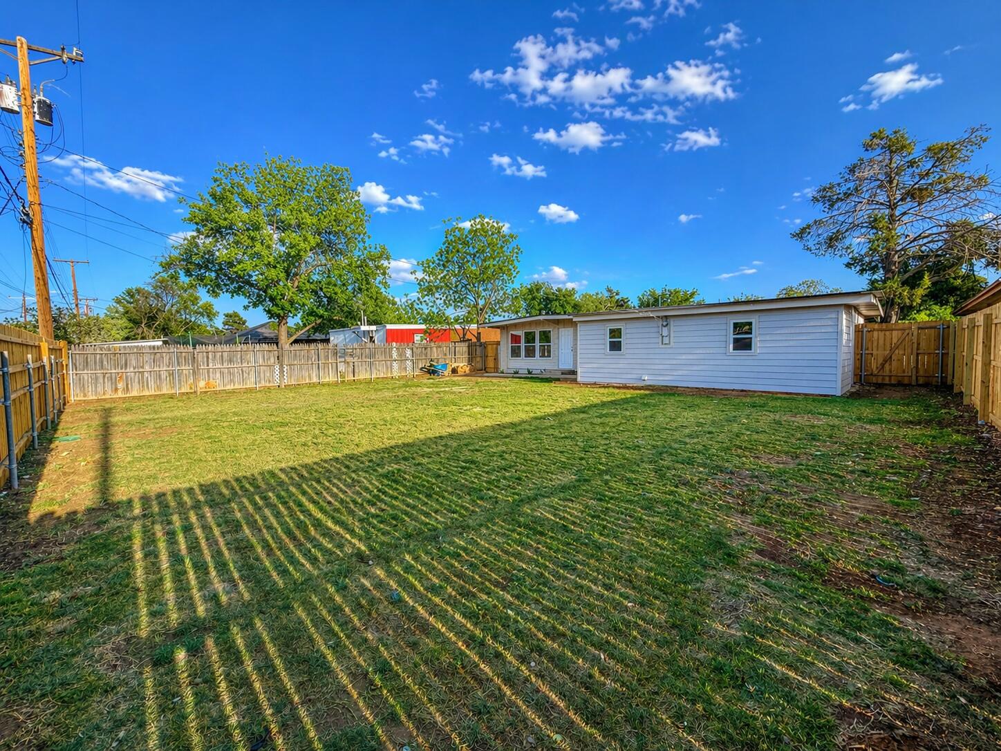 2316 48th Street Lubbock, TX 79412 - Photo 17 of 18 a view of a golf course with a swimming pool
