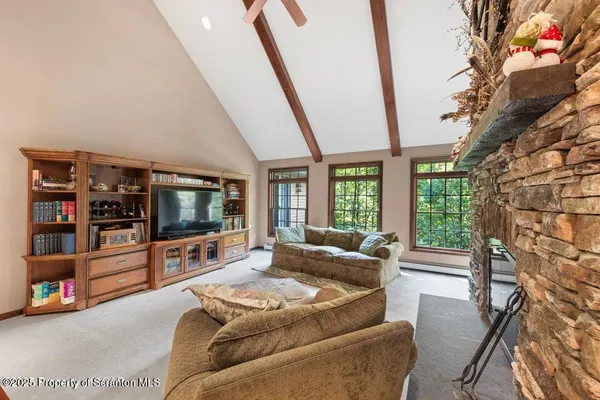 a dining room with furniture and window