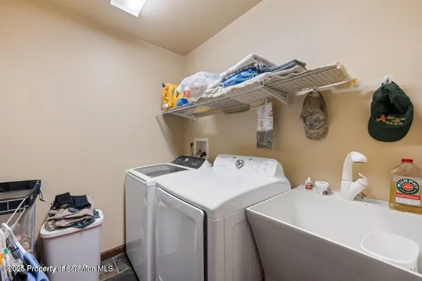 a spacious bedroom with bed and window