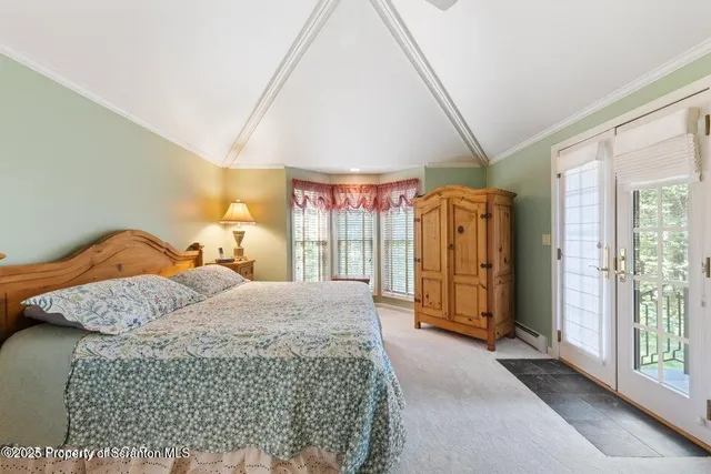 a view of a livingroom with furniture and a flat screen tv