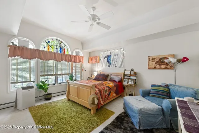 a bed room with a bed and a window