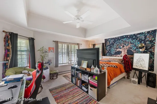 a bathroom with a toilet and a shower curtain