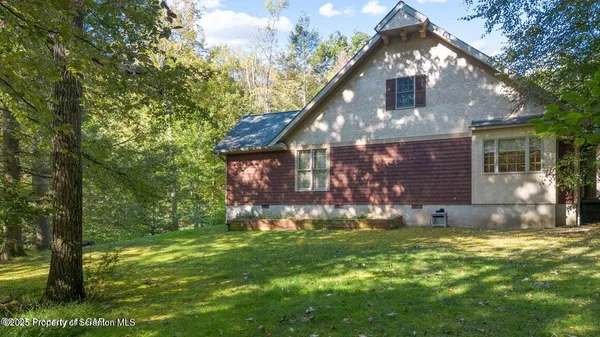 a view of a livingroom with furniture and hardwood floor