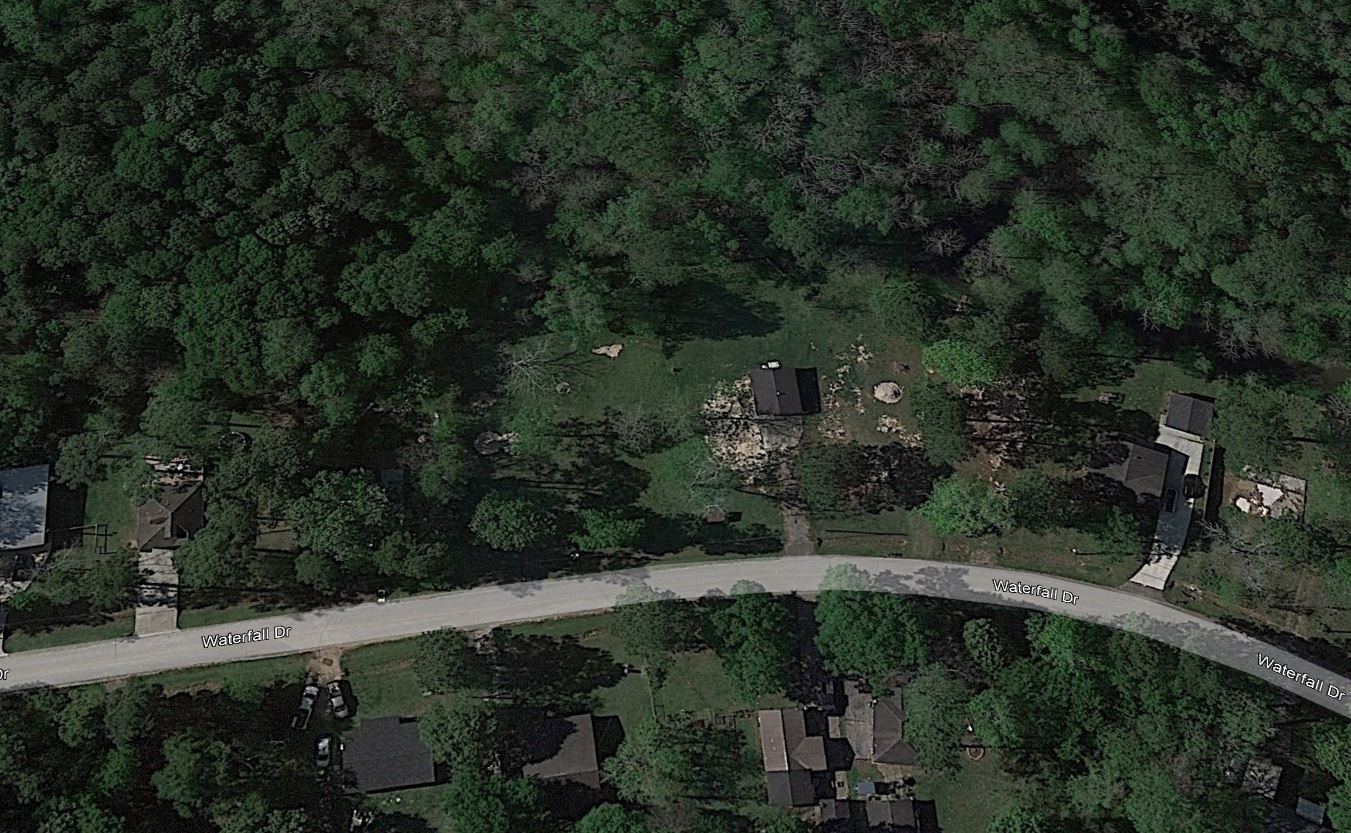 302 Waterfall Drive Huffman, TX 77336 - Photo 8 of 17 an aerial view of a house having yard