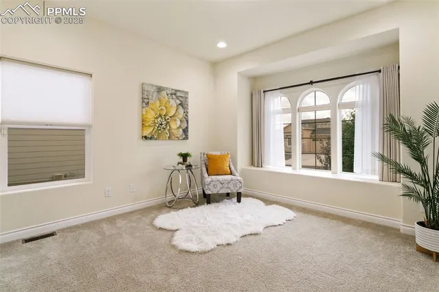 a bathroom with a granite countertop toilet a sink and a mirror