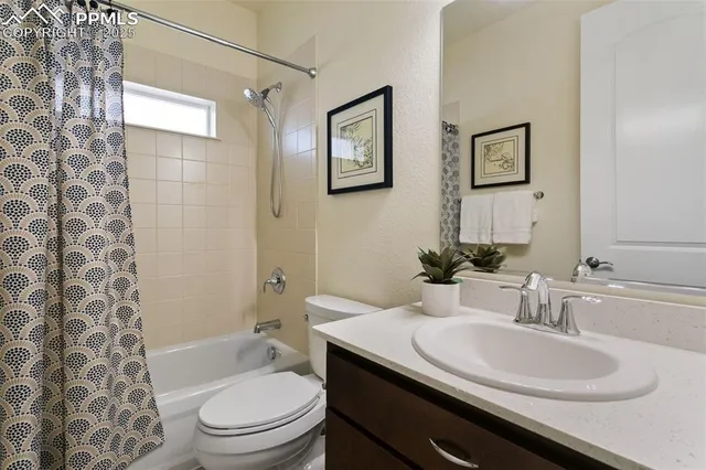 a kitchen with stainless steel appliances granite countertop a sink a refrigerator and a stove with wooden floor