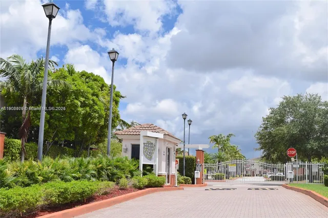 a view of a street with a building in the background