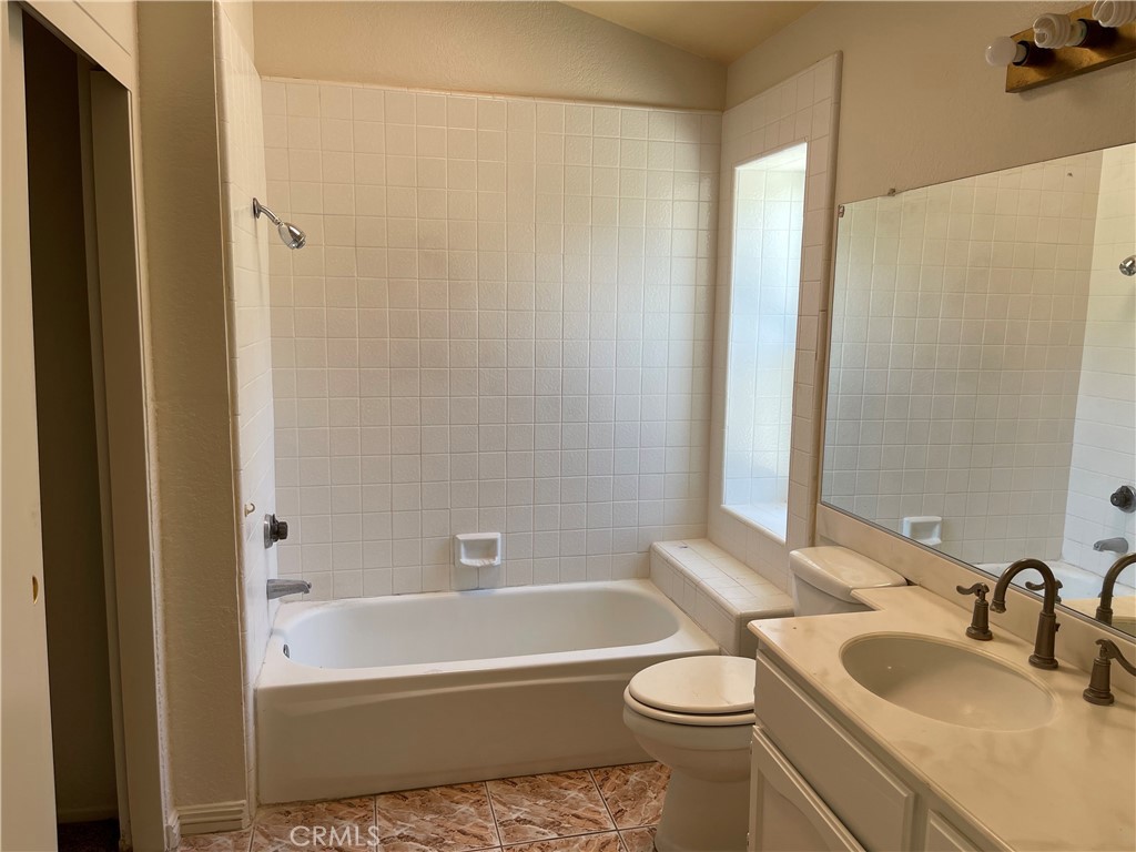 1341 Grovehill Drive Riverside, CA 92507 - Photo 18 of 23 a bathroom with a sink a toilet and shower