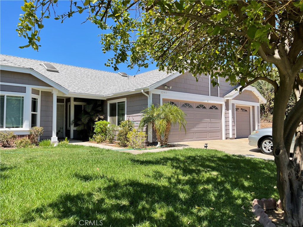 1341 Grovehill Drive Riverside, CA 92507 - Photo 2 of 23 a front view of a house with a yard