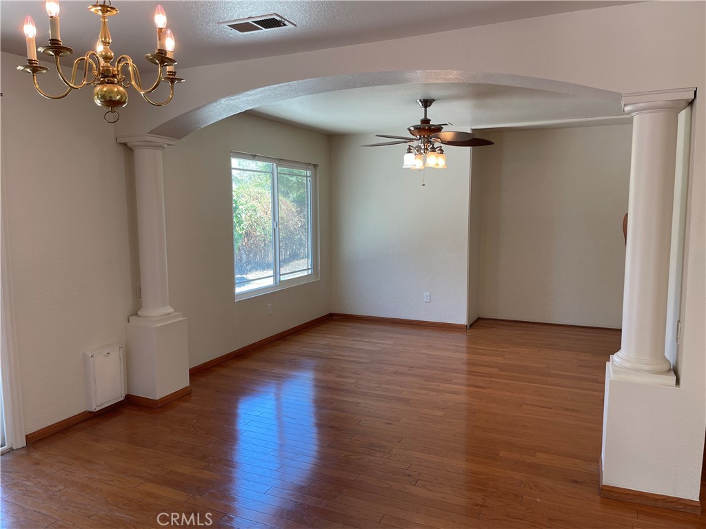 1341 Grovehill Drive Riverside, CA 92507 - Photo 8 of 23 a view of a livingroom with a ceiling fan window and hardwood floor