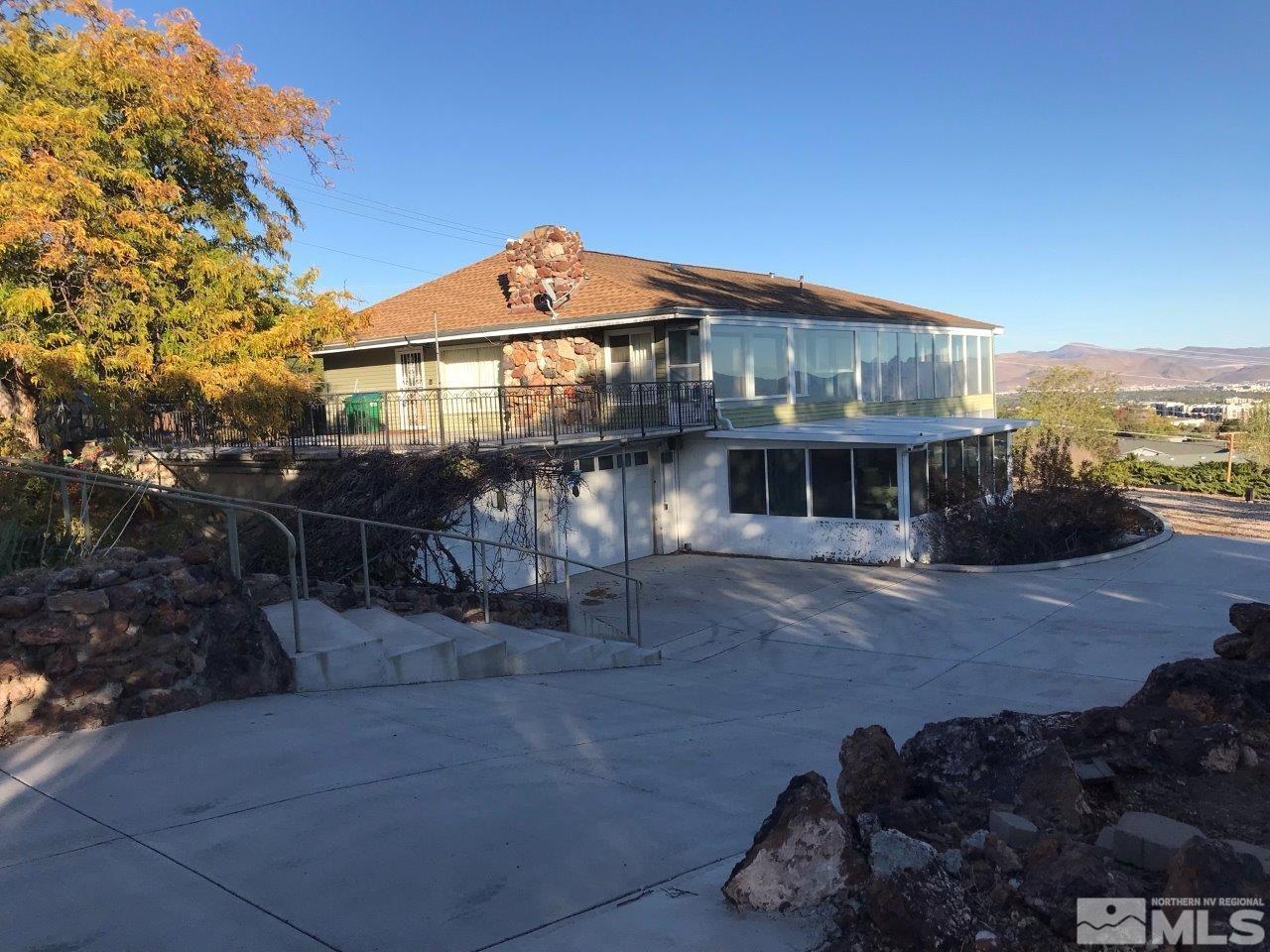 30 Greenstone Circle Reno, NV 89512 - Photo 1 of 34 a front view of a house with a yard