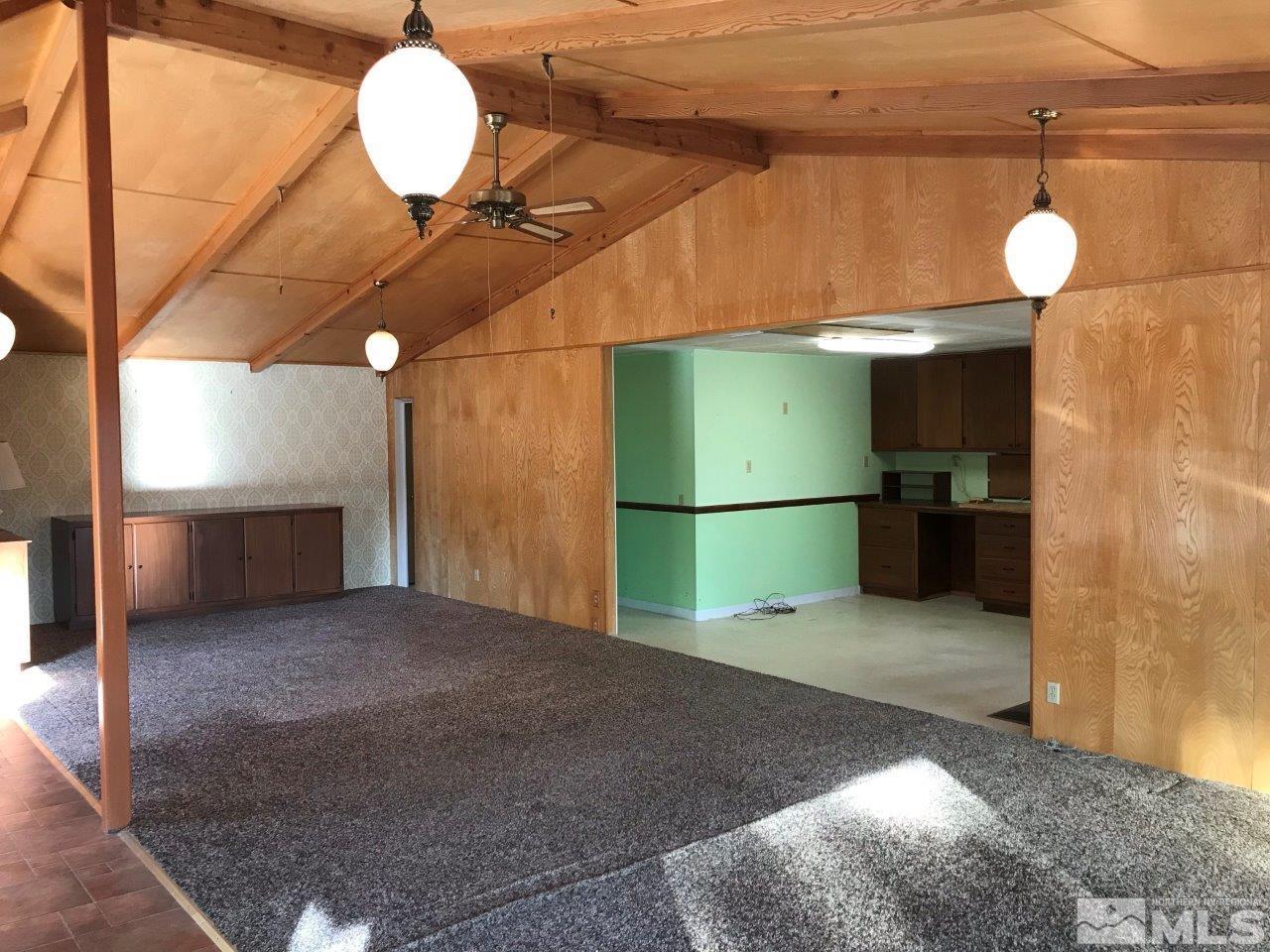 30 Greenstone Circle Reno, NV 89512 - Photo 11 of 34 a view of a room with a fireplace and wooden floors