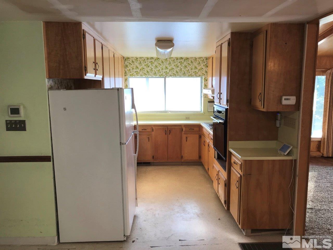 30 Greenstone Circle Reno, NV 89512 - Photo 13 of 34 a kitchen with stainless steel appliances a refrigerator and a stove
