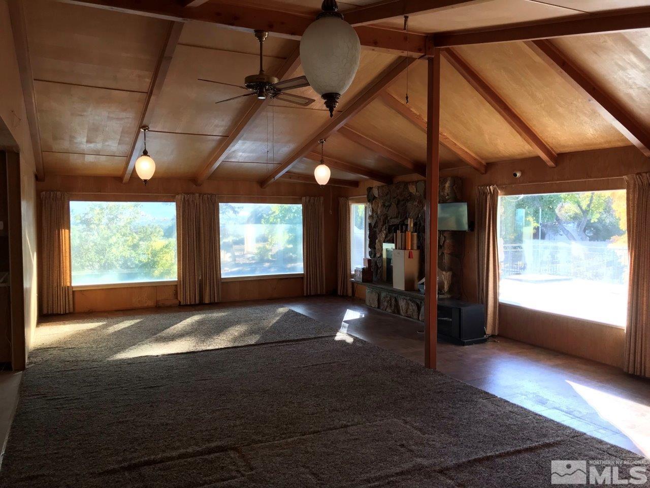 30 Greenstone Circle Reno, NV 89512 - Photo 8 of 34 a view of empty room with wooden floor and fan