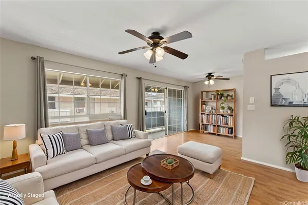 a living room with furniture and a large window