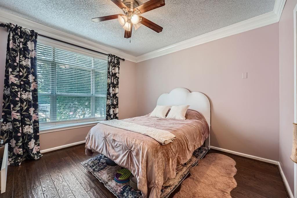955 Juniper Street Northeast, Unit 4127 Atlanta, GA 30309 - Photo 12 of 29 a bedroom with a bed and a window