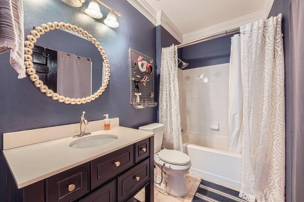 955 Juniper Street Northeast, Unit 4127 Atlanta, GA 30309 - Photo 15 of 29 a bathroom with a sink a toilet and shower