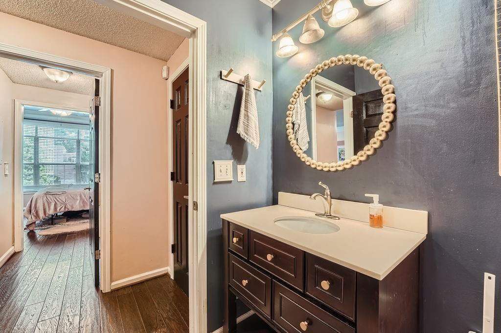 955 Juniper Street Northeast, Unit 4127 Atlanta, GA 30309 - Photo 16 of 29 a bathroom with a sink and a mirror