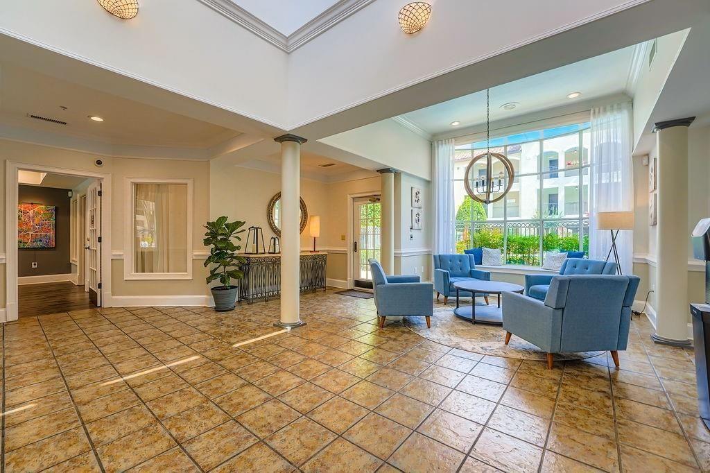 955 Juniper Street Northeast, Unit 4127 Atlanta, GA 30309 - Photo 24 of 29 a living room with furniture and a large window