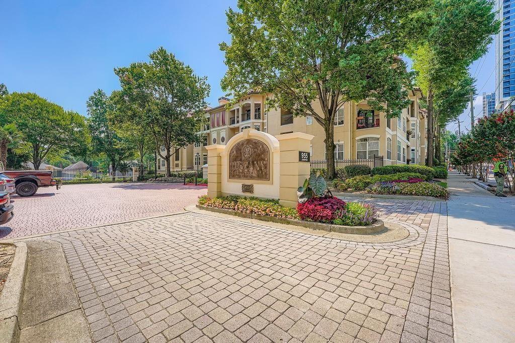 955 Juniper Street Northeast, Unit 4127 Atlanta, GA 30309 - Photo 26 of 29 a view of a white house with a yard