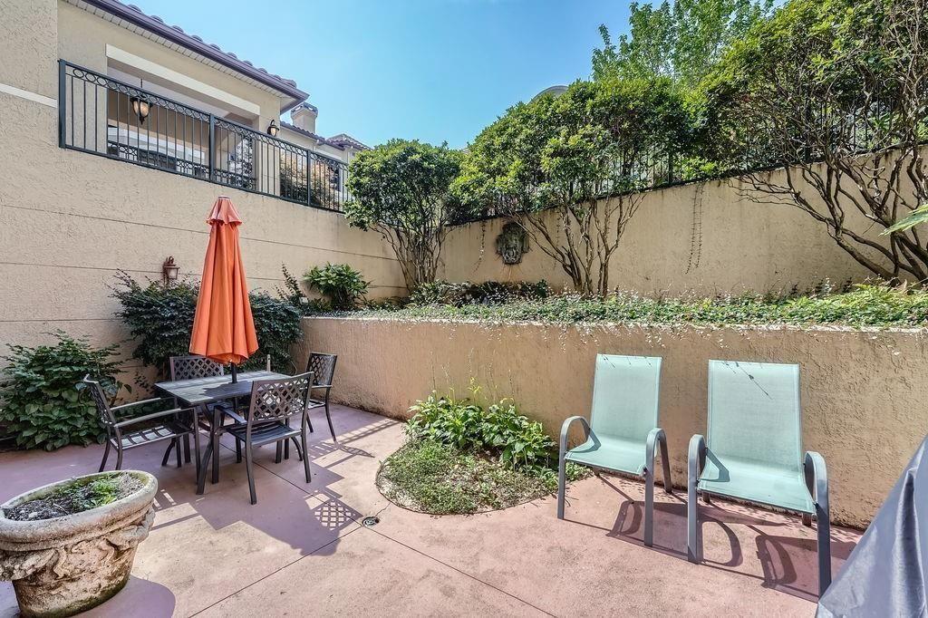 955 Juniper Street Northeast, Unit 4127 Atlanta, GA 30309 - Photo 27 of 29 a view of backyard with outdoor seating and plants