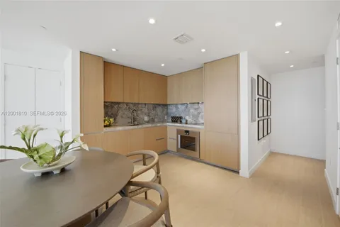 a view of a kitchen with a sink a window and stainless steel appliances