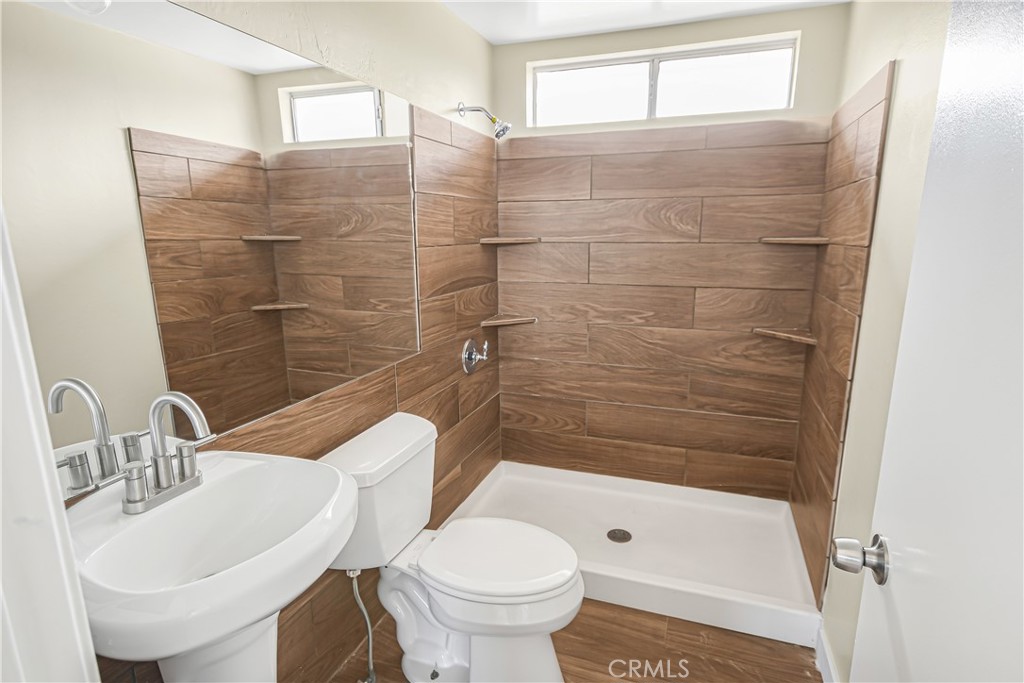 7773 Sequoia Road Phelan, CA 92371 - Photo 15 of 32 a bathroom with a sink a toilet and shower