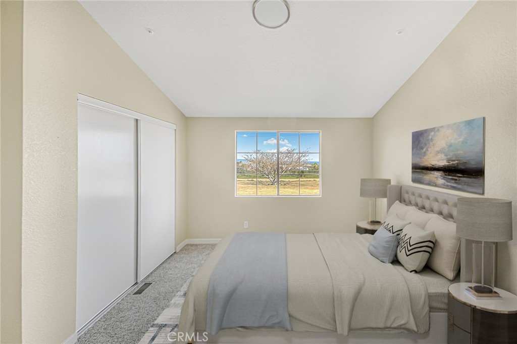 7773 Sequoia Road Phelan, CA 92371 - Photo 17 of 32 a bedroom with a bed and flat screen tv