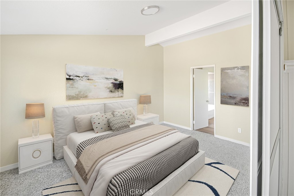 7773 Sequoia Road Phelan, CA 92371 - Photo 18 of 32 a bedroom with a large bed and a shower