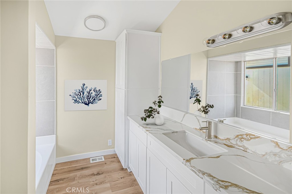 7773 Sequoia Road Phelan, CA 92371 - Photo 20 of 32 a bathroom with a sink and a mirror